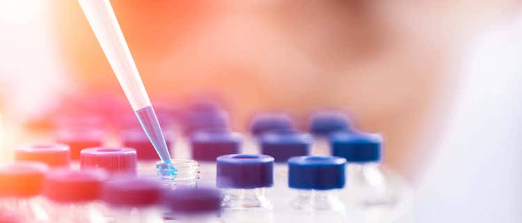Female chemist at work in laboratory.